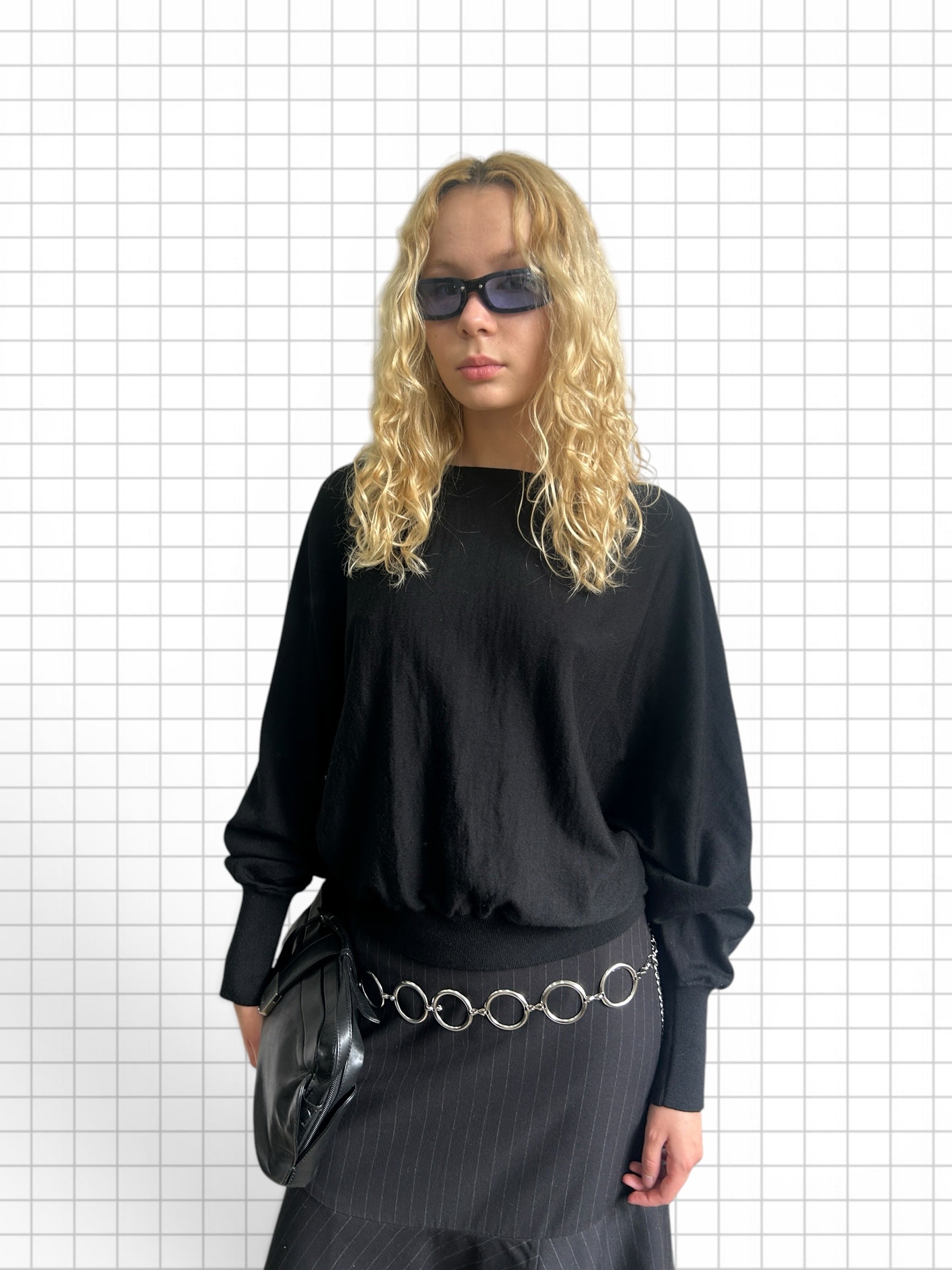 Wieder Wieder black long-sleeve knit sweater with dropped shoulders and ribbed cuffs worn by a blonde model