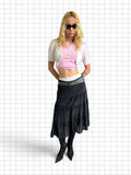 Wieder Wieder black tiered midi skirt with intricate eyelet lace embroidery worn by a model with a pink crop top