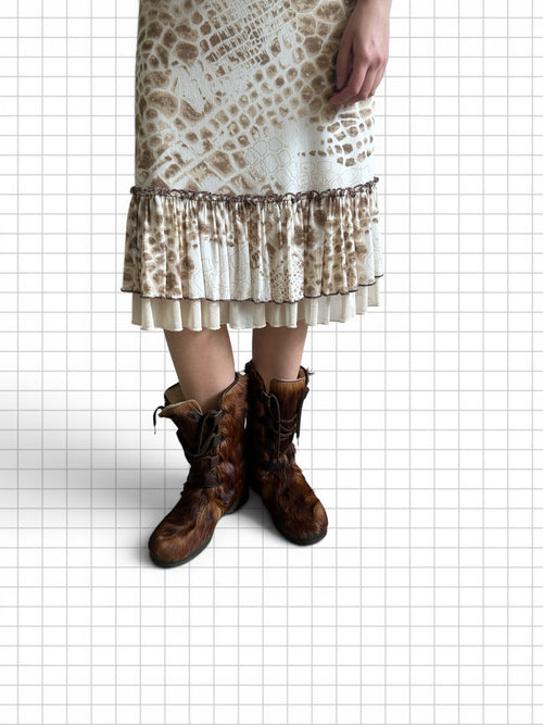 Wieder Wieder brown textured calf hair lace-up winter boots worn with a patterned midi skirt on a grid background