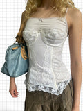 Wieder Wieder cream lace corset camisole with structured bustier detailing, dainty bows, and adjustable straps.