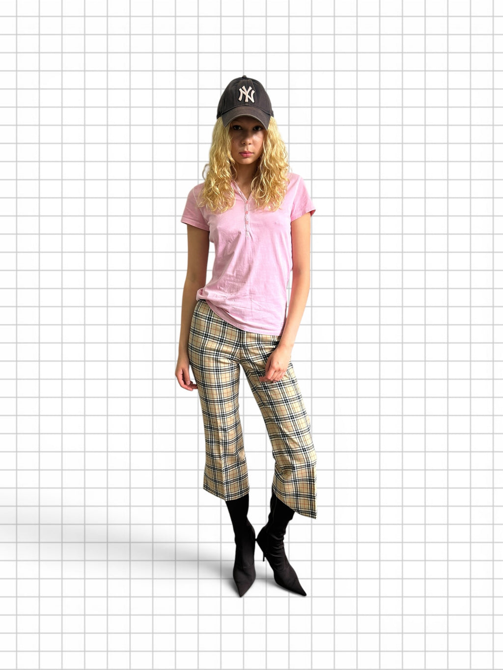 Wieder Wieder plaid cropped trousers in beige, black, and red check worn with a pink polo and black ankle boots.