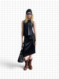Wieder Wieder black midi skirt with side ring detail worn by a model with a black top, beanie, and brown boots.