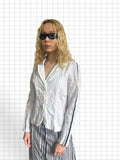Wieder Wieder white lightweight blazer with oversized buttons and dark vertical sleeve stripes on a blonde model
